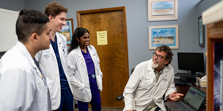 Medical students at KCU meeting with Dr. King